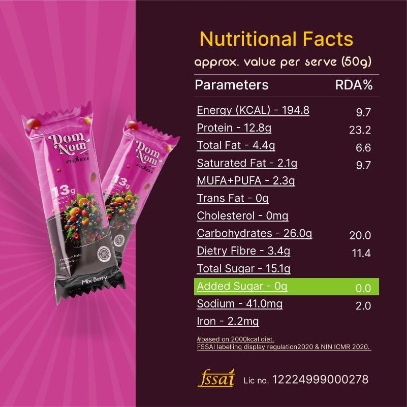 Dom Nom Mix Berry Protein Bar - A delicious and nutritious protein bar with 13g protein, natural sugar, and no chalky taste. Made with 0% added sugar, featuring a clean label for a guilt-free snack. Hand holding the vibrant pink packaging against a berry-themed background
