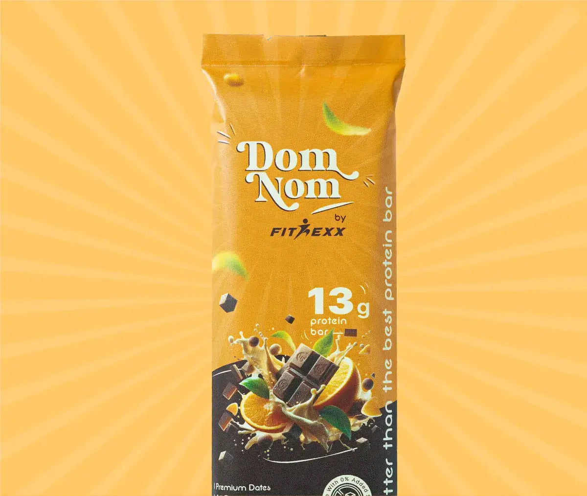 Dom Nom Choco orange Protein Bar - A delicious and nutritious protein bar with 13g protein, natural sugar, and no chalky taste. Made with 0% added sugar, featuring a clean label for a guilt-free snack. Hand holding the vibrant pink packaging against a berry-themed background